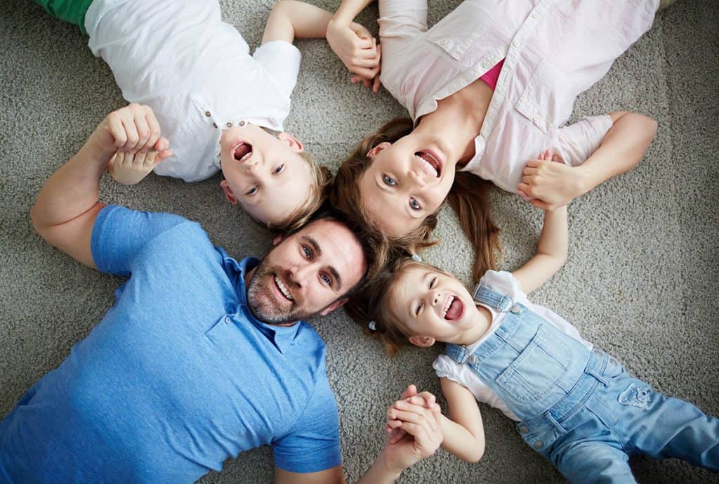 Young Family together in a circle